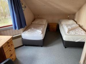 Ένα ή περισσότερα κρεβάτια σε δωμάτιο στο Ferienhaus im skandinavischen Stil