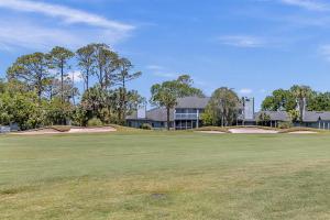 a golf course with two putts on a green at Belle Vue - Modern condo near beach w golf views in Ponte Vedra Beach