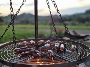 a bunch of food cooking on a grill at Spacious Valley Views Near City & Coast in Whangarei
