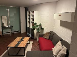 a living room with a couch and a coffee table at Apartment in Heidelberg with Neckar view in Niederdorla