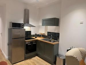 Kuchyň nebo kuchyňský kout v ubytování La Location des Géants - Appartement avec terrasse