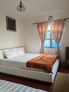 En eller flere senge i et værelse på Better Table Africa + 29 billeder