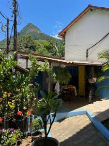 a house with a view of a mountain at Buena Onda Suites in Abraão +31 photos