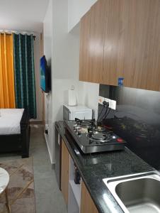 Η κουζίνα ή μικρή κουζίνα στο ONeal Prime Suites - Furnished Studio apartments in Nairobi Near JKIA & SGR