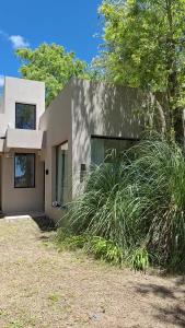 a house with tall grass in front of it at Casa XIII in Costa del Este