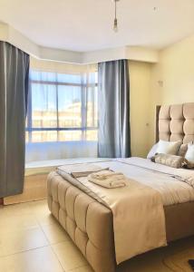 Ένα ή περισσότερα κρεβάτια σε δωμάτιο στο Belaire BnB Syokimau