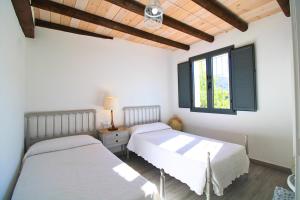 Postel nebo postele na pokoji v ubytování Casa La Abubilla