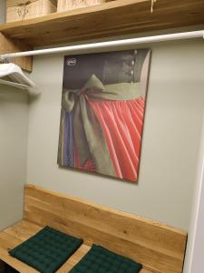 a painting of a woman with a dress on a wall at Alpenperle in Sankt Johann im Pongau +7 photos