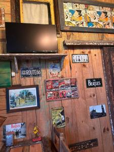 a wall with posters and signs on it at La mar in La Pedrera