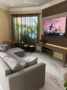 Μια τηλεόραση ή/και κέντρο ψυχαγωγίας στο Casa ao mar -Pousada Itapema