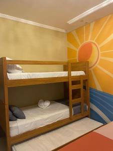 Ένα ή περισσότερα κρεβάτια σε δωμάτιο στο Casa ao mar -Pousada Itapema +73 φωτογραφίες