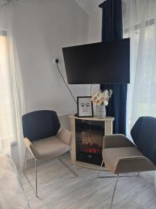 TV a/nebo společenská místnost v ubytování Ravell Lodge- occasional rental + 19 fotografií