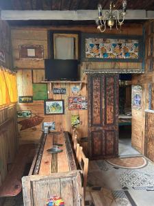 a room with a large wooden table and wooden walls at La mar in La Pedrera