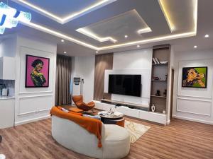 Телевизор и/или развлекательный центр в HavenHomes 1 bedroom Apartment