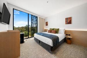 Un televizor și/sau centru de divertisment la Urban Rest Hackney Hotel