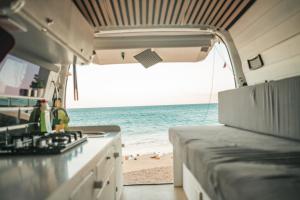 an rv with a view of the beach at Mini Camper Van Hot Water, You Can Drive it in Telde