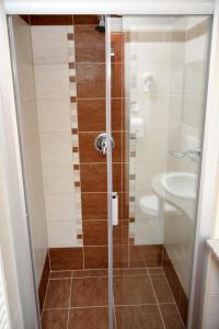 Kúpeľňa v ubytovaní Lugas Hotel