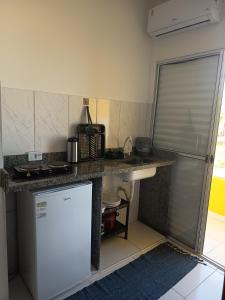 Kuchyň nebo kuchyňský kout v ubytování Pousada Peruíbe Frente ao Mar - Suítes, Kitnets e Apto + 5 fotografií