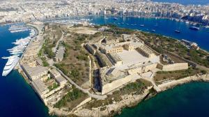 an aerial view of an island in the water at Studio Groundfloor Apartment in Il-Gżira +3 photos