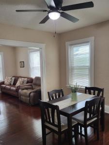 a living room with a table and a couch at Apt 1 Stylish First Floor Apartment in Worcester +14 photos