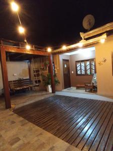 a room with a large wooden dance floor at night at Casa aconchegante e familiar no bairro Vila Nova in Joinville