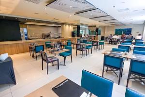 Un restaurante u otro lugar para comer en Stay Inn Santos Sua acomodação com cara de Hotel