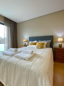 Ένα ή περισσότερα κρεβάτια σε δωμάτιο στο Casa d'Avó Dete, Férias no coração do Minho