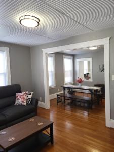 a living room with a couch and a table at Apt 2 2nd Floor in the Heart of the City in Worcester
