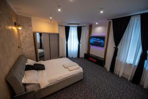 Postel nebo postele na pokoji v ubytování Vibe90 apartament centru istoric