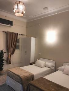 Ένα ή περισσότερα κρεβάτια σε δωμάτιο στο Wonji house