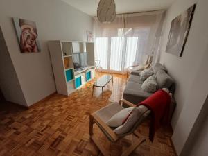 a living room with a couch and a table at apartamento gran Vía in Ribadesella