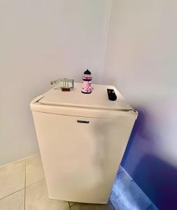 a toilet with a hello kitty on top of it at #PéNaAreia em Matinhos Beach in Matinhos