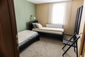 Postel nebo postele na pokoji v ubytování Apartmani ZOV GOLIJE