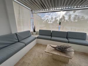 a living room with a couch and a table at Condo cozy 1bdr 1bth in Punta Cana