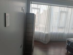 Ένα ή περισσότερα κρεβάτια σε δωμάτιο στο Puno- Departamento