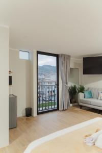 En eller flere senge i et værelse på Estancia del Alba