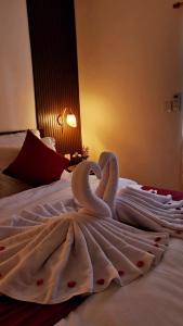 Ένα ή περισσότερα κρεβάτια σε δωμάτιο στο GYANA House