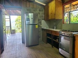 Køkken eller tekøkken på Cabaña Mirador de Vilcabamba + 8 billeder