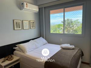 En eller flere senge i et værelse på Nautilus Refúgio da Alegria - Penha/SC