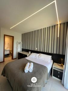 En eller flere senge i et værelse på Nautilus Refúgio da Alegria - Penha/SC