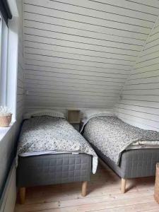 Кровать или кровати в номере Sommerhus Med Spa, Sauna Og Vildmarksbad