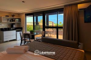 Ένα ή περισσότερα κρεβάτια σε δωμάτιο στο Hit Cabo Branco - LikeHome Hospedagens