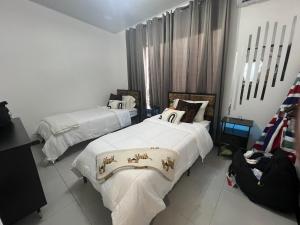 Ένα ή περισσότερα κρεβάτια σε δωμάτιο στο JJ Lux Residential