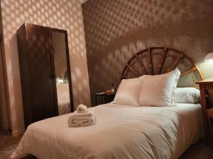 Postel nebo postele na pokoji v ubytování hôtel et restaurant les2M