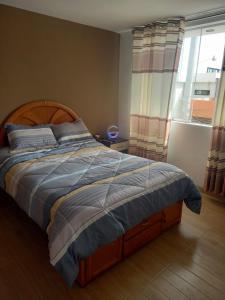 En eller flere senge i et værelse på Brand new apartment perfect for summer