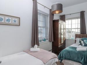 Ένα ή περισσότερα κρεβάτια σε δωμάτιο στο Delmonte Lodge +32 φωτογραφίες