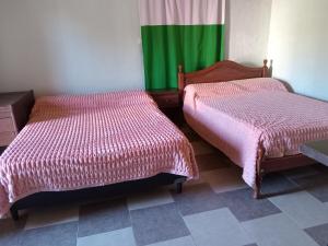 En eller flere senge i et værelse på Alquileres del valle