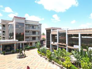 a rendering of an apartment complex with buildings at The Planet Hotel 