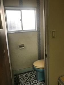 a bathroom with a toilet and a window at YabFarm Lodge 102 in Kashiwa +21 photos