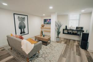 a living room with a couch and a table at Hidden Escape Atlanta Near BENZ ARPT Beltline in Atlanta